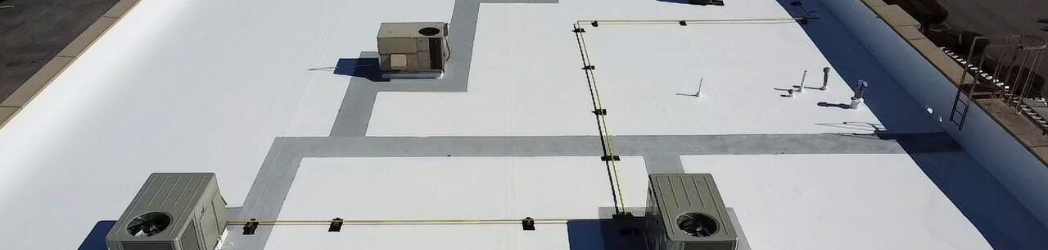 The image is of a fully restored commercial roof.