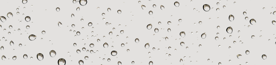 The image is of a gray background with water droplets over it.