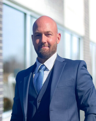 The image is of Dallas Manker's headshot.