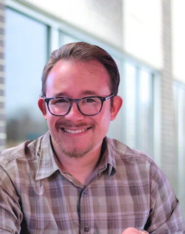 The image is of Dallas Manker's headshot.