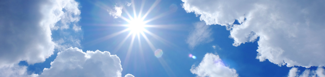 The image is of the sun shining in the sky.