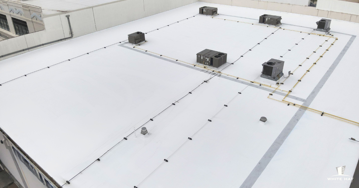 A white roof restored with a White Hat Industrial solution.